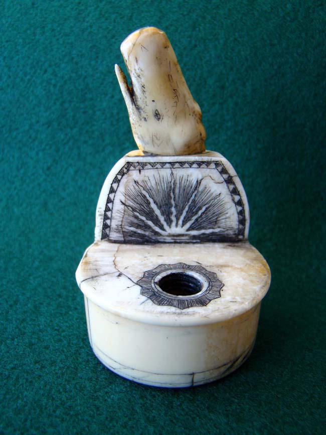 A charming Walrus and Whale Ivory Inkwell